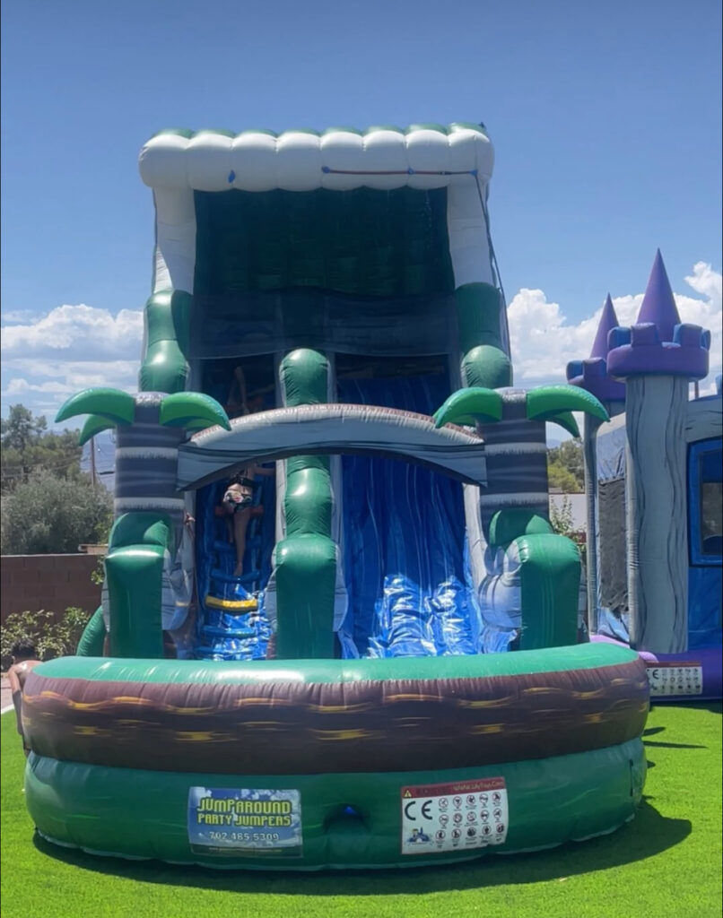 Bright green inflatable waterslide featuring a climbing area and splash pool, set in a sunny backyard, ideal for summer fun and parties.